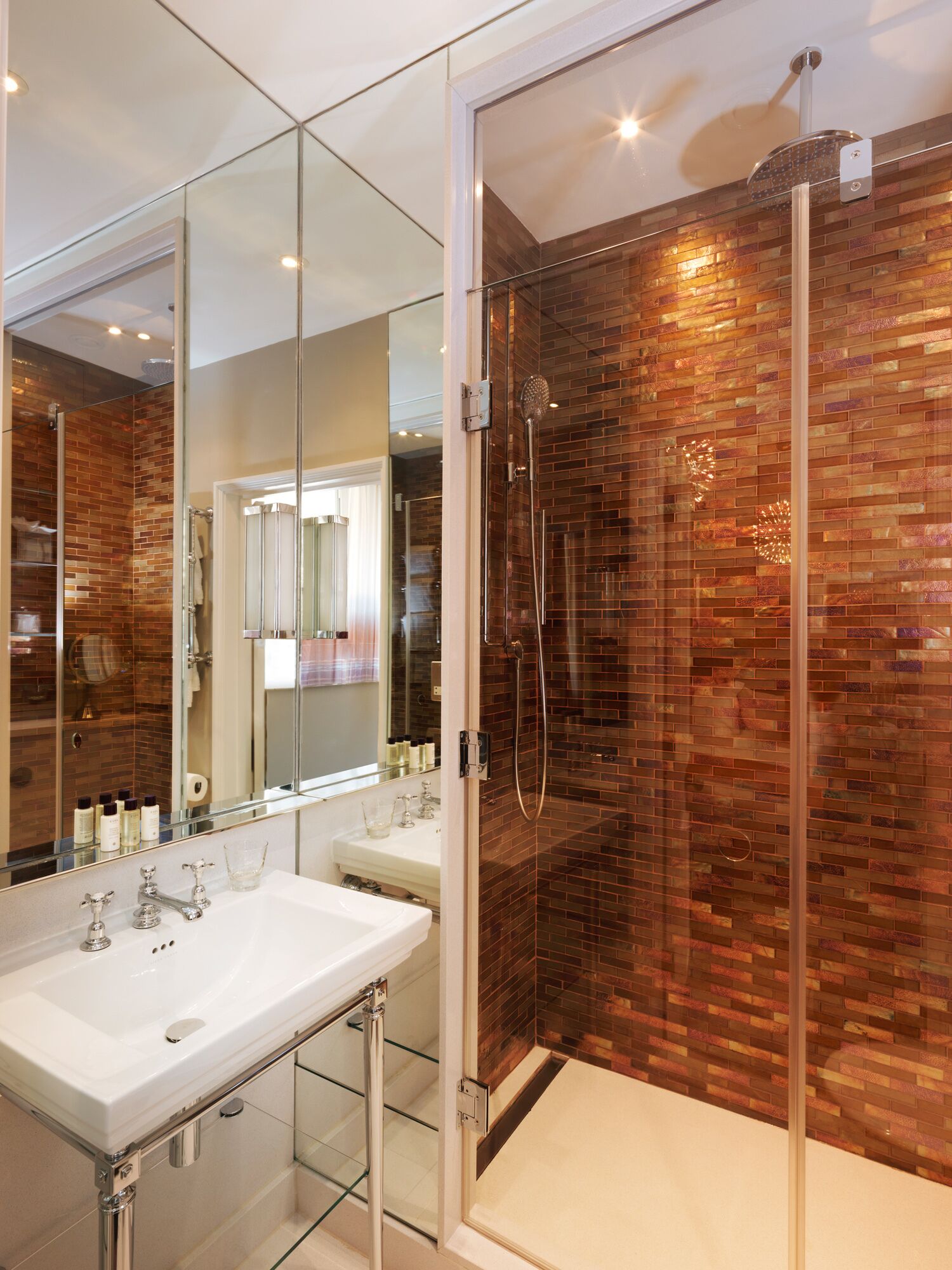 luxury one bedroom apartment | bathroom | designer toiletries, hair dryer, bathrobes, slippers