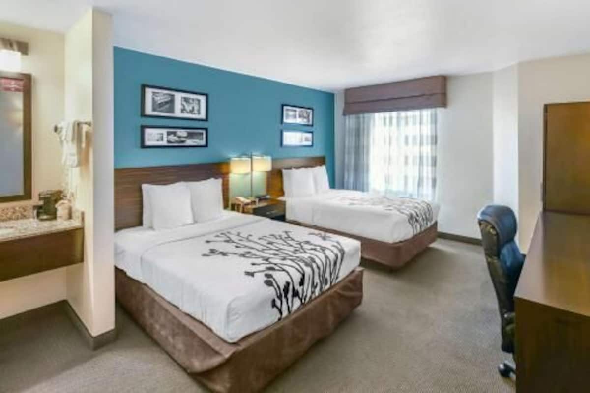 Premium bedding, desk, laptop workspace, iron/ironing board
