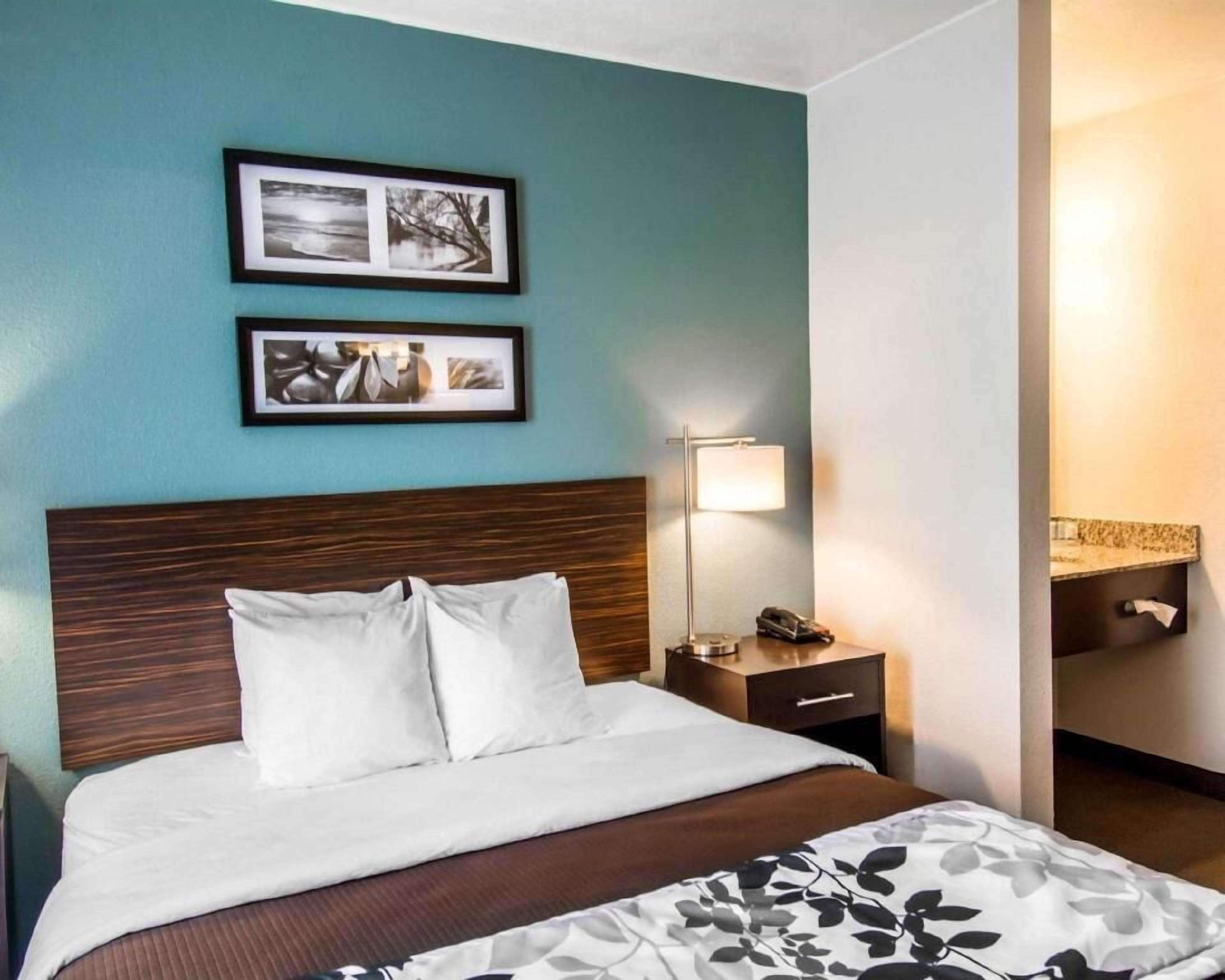 Premium bedding, desk, laptop workspace, iron/ironing board