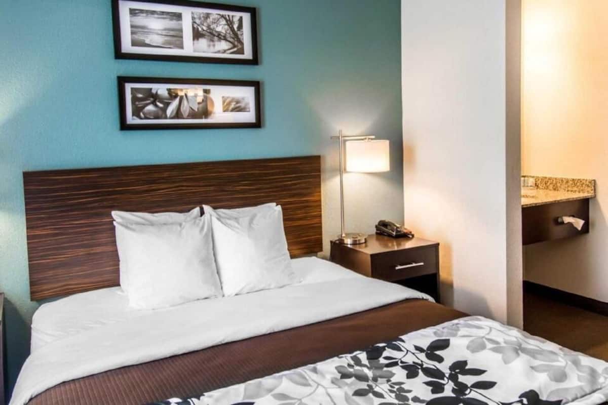 Premium bedding, desk, laptop workspace, iron/ironing board