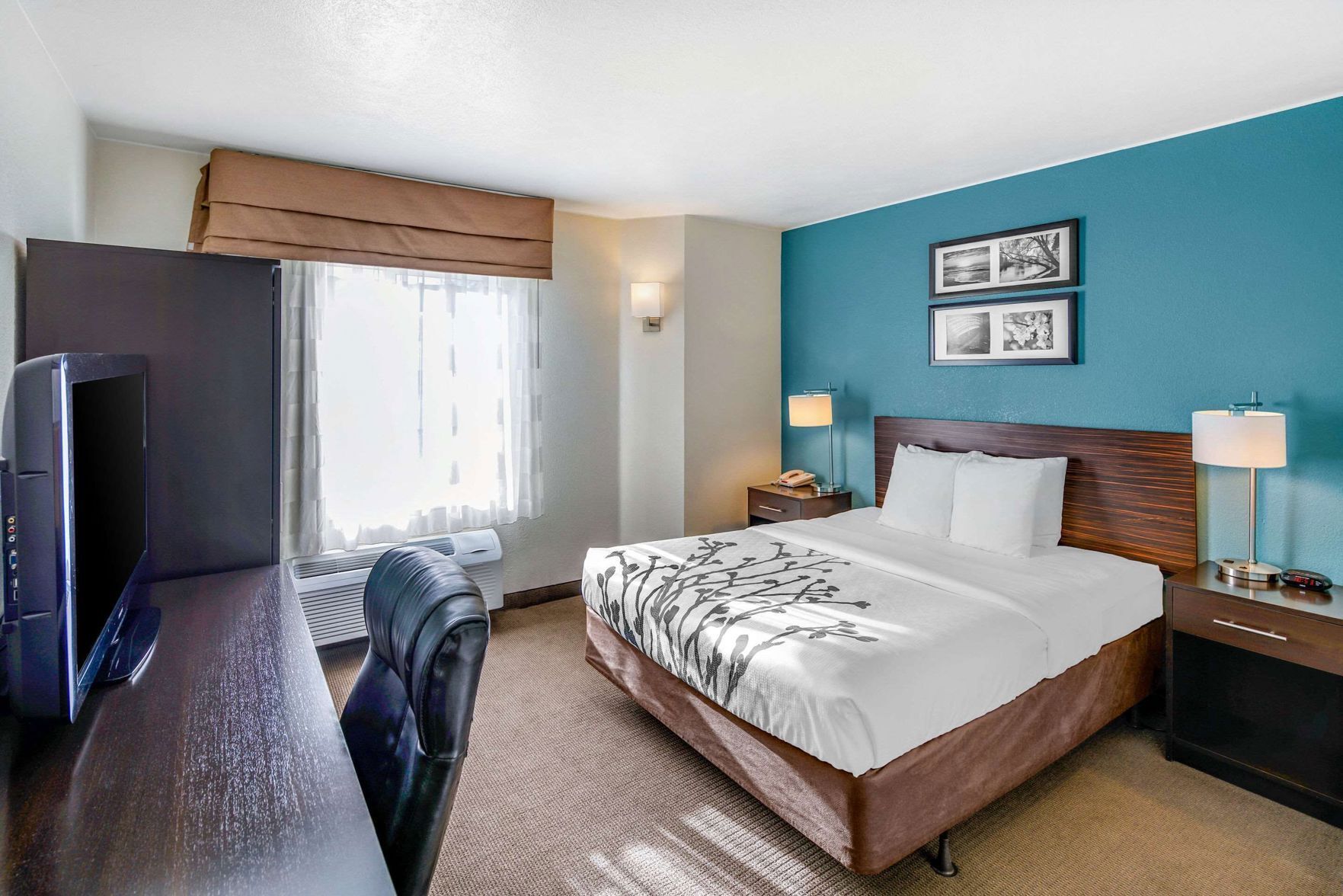 Premium bedding, desk, laptop workspace, iron/ironing board