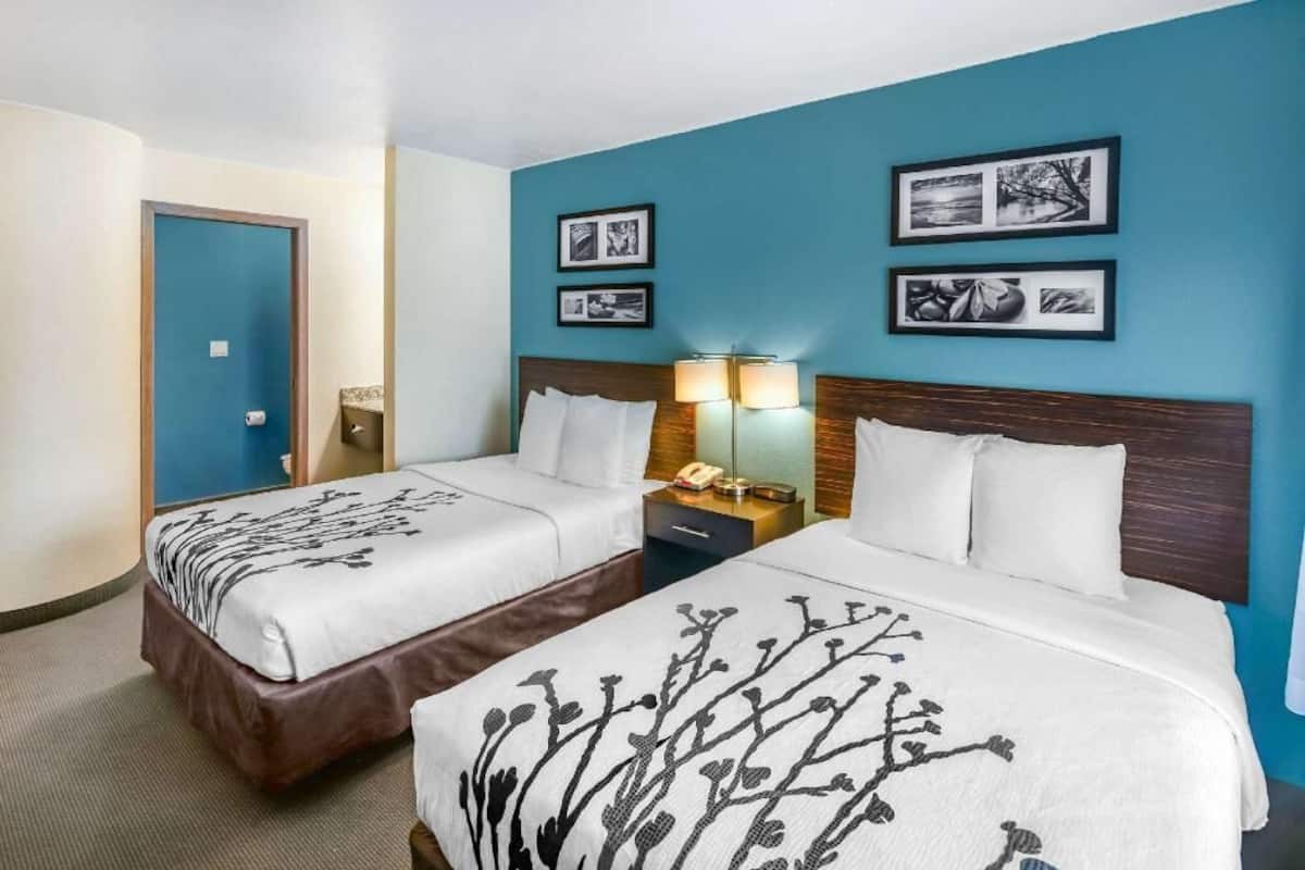 Premium bedding, desk, laptop workspace, iron/ironing board