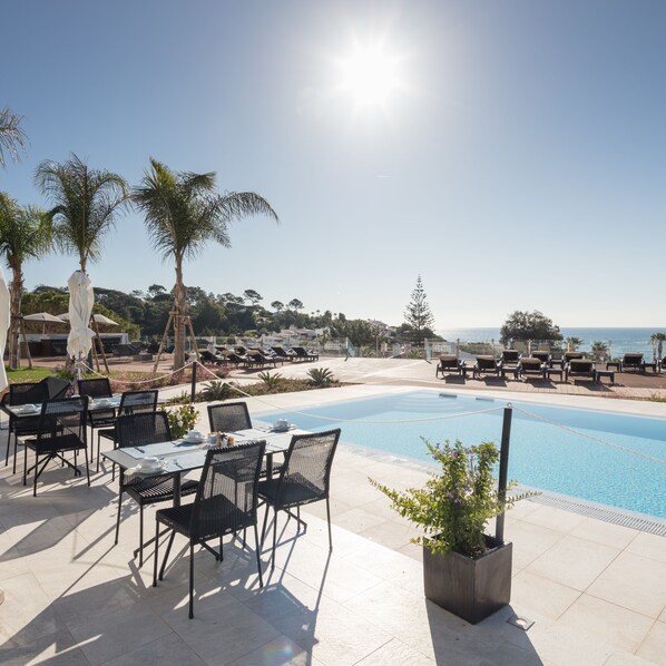 Outdoor pool, pool umbrellas, pool loungers