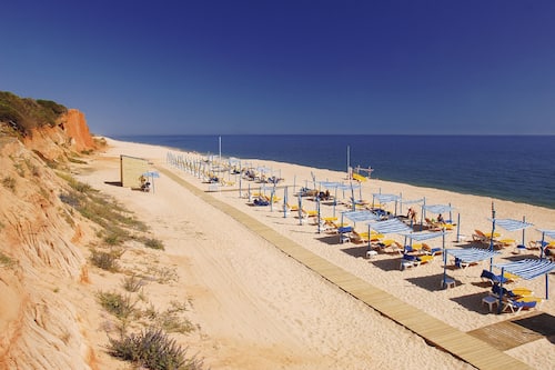 On the beach, sun-loungers, beach umbrellas, beach towels