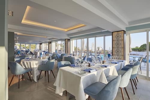 Breakfast, lunch, dinner served; international cuisine, pool views