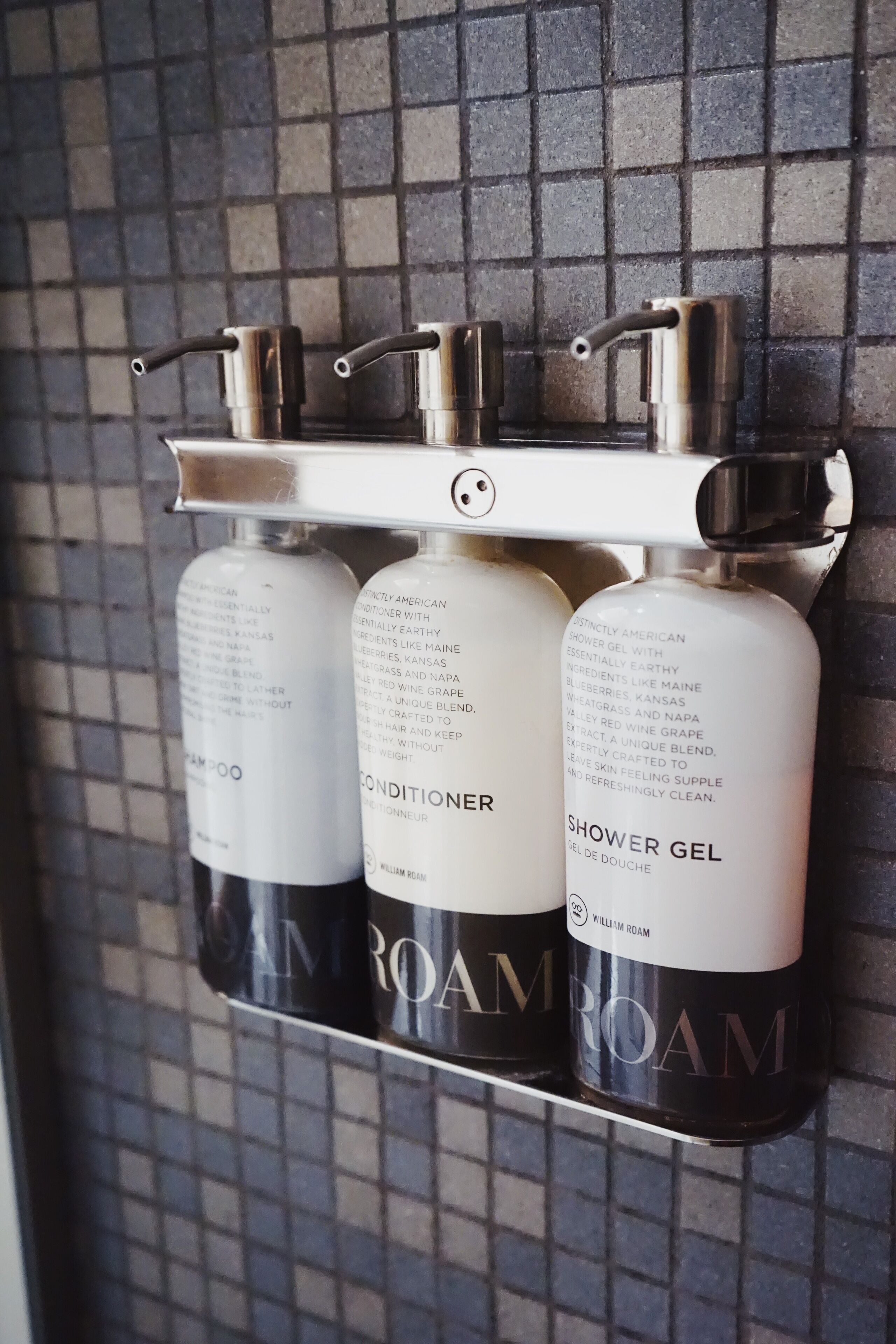 designer toiletries, hair dryer, towels, soap