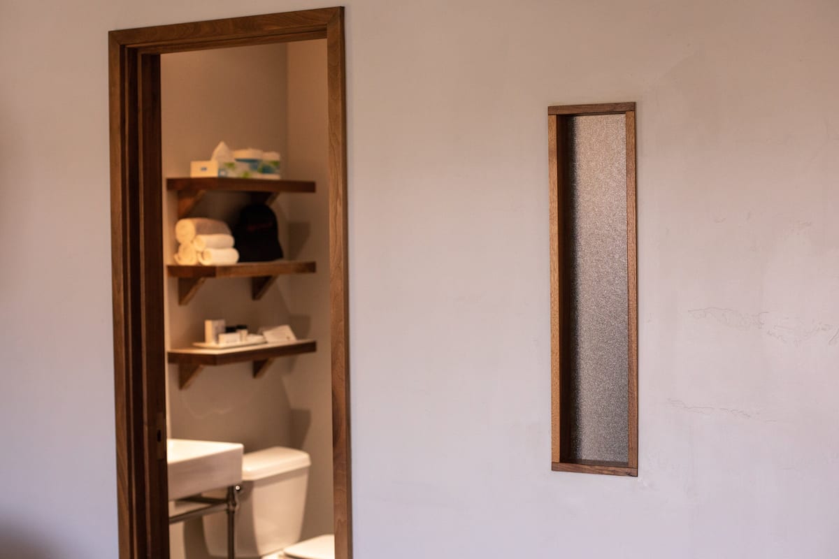 designer toiletries, hair dryer, towels, soap