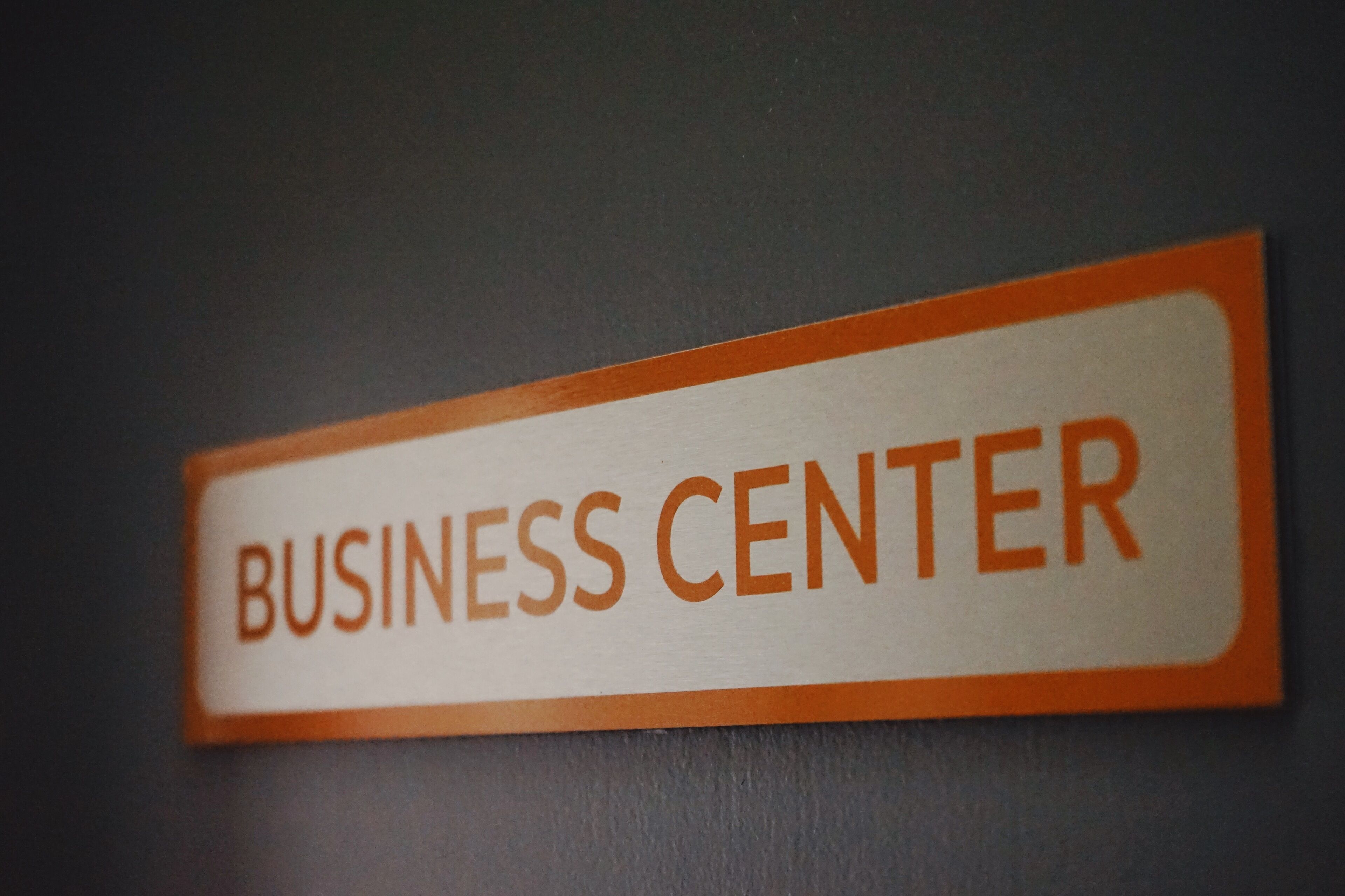 A sign with the text "BUSINESS CENTER".