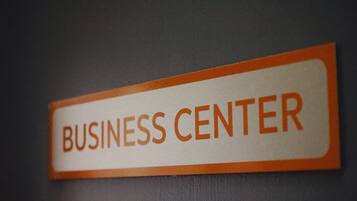 A sign with the text "BUSINESS CENTER".