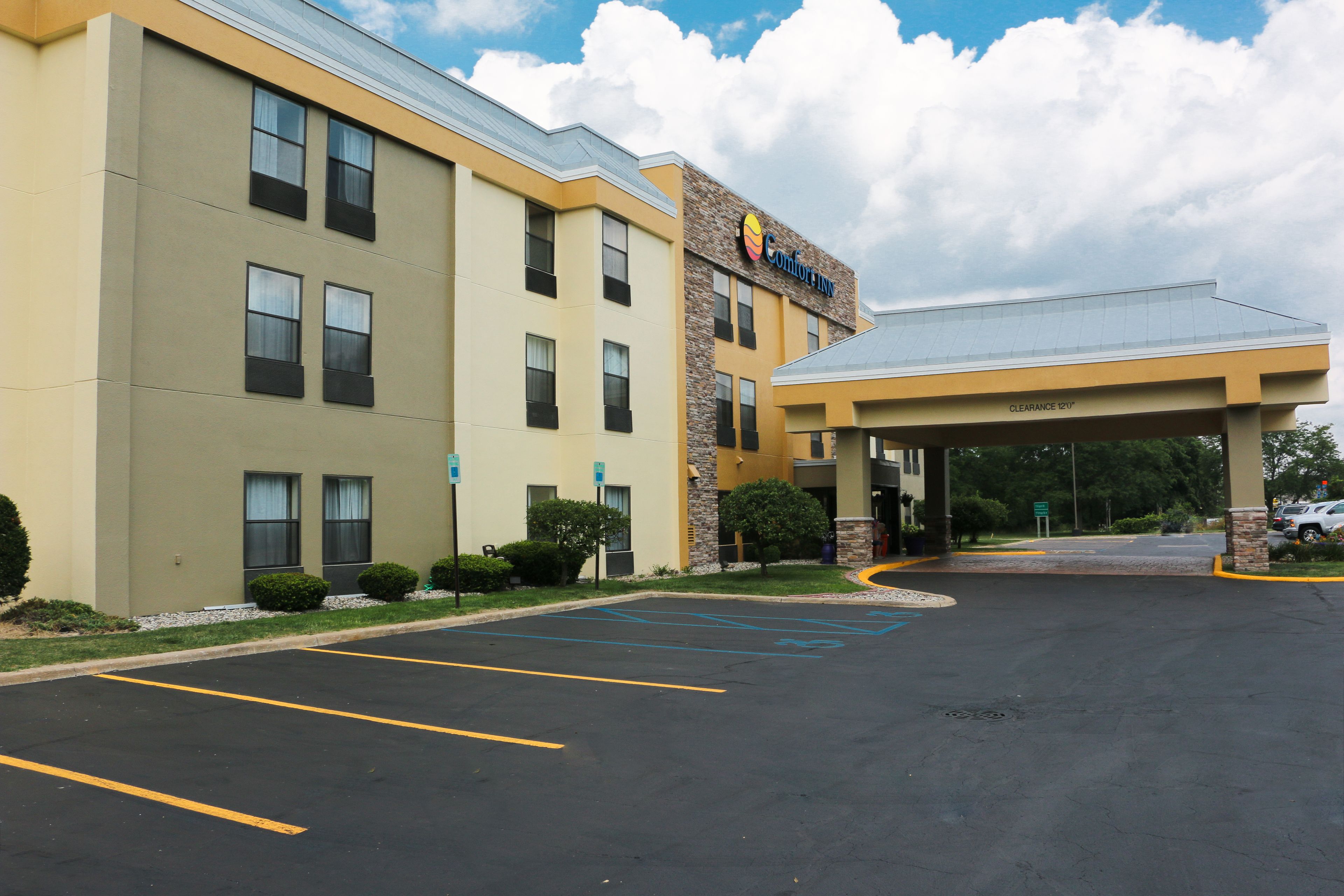 A Comfort Inn hotel with a parking lot and a covered entrance.
