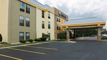 A Comfort Inn hotel with a parking lot and a covered entrance.