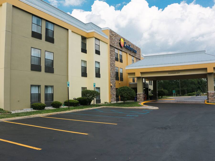 A Comfort Inn hotel with a parking lot and a covered entrance.