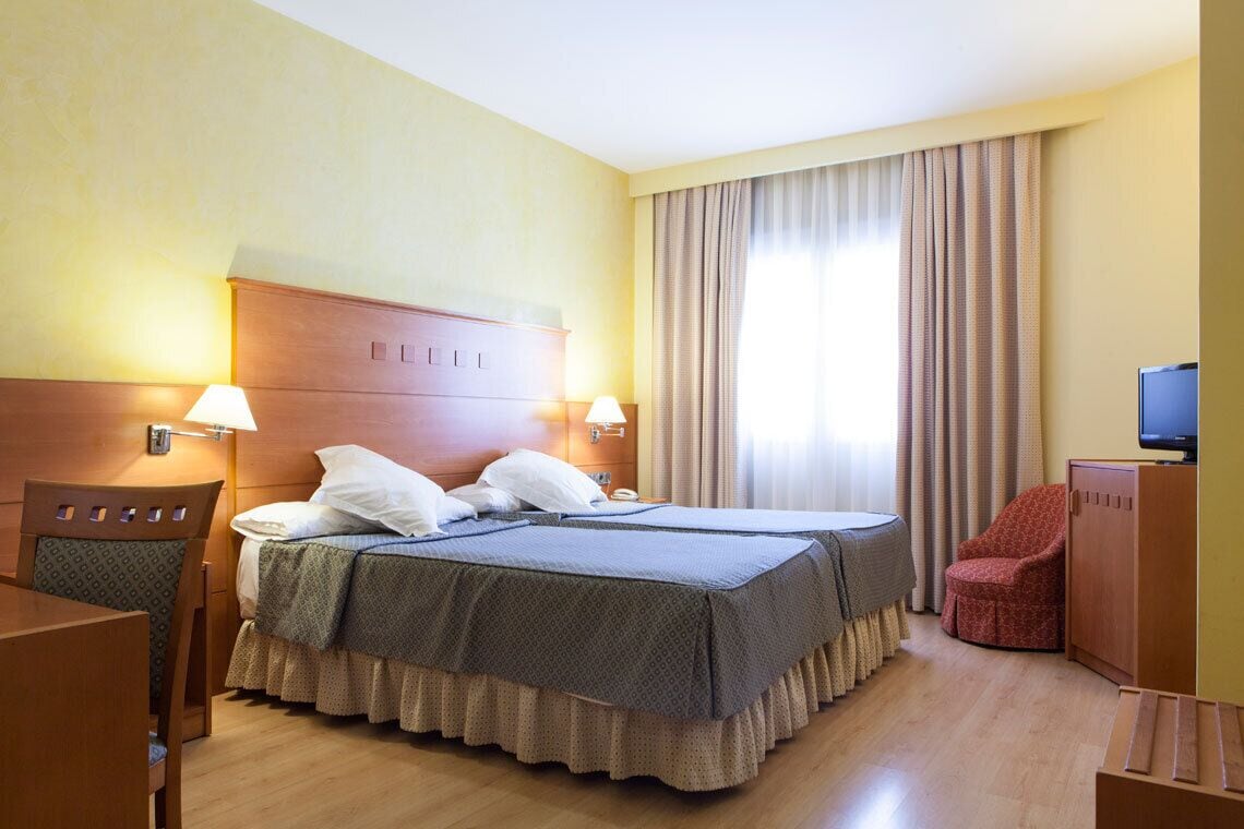 Luxe beddengoed, een minibar, een kluis op de kamer, een bureau