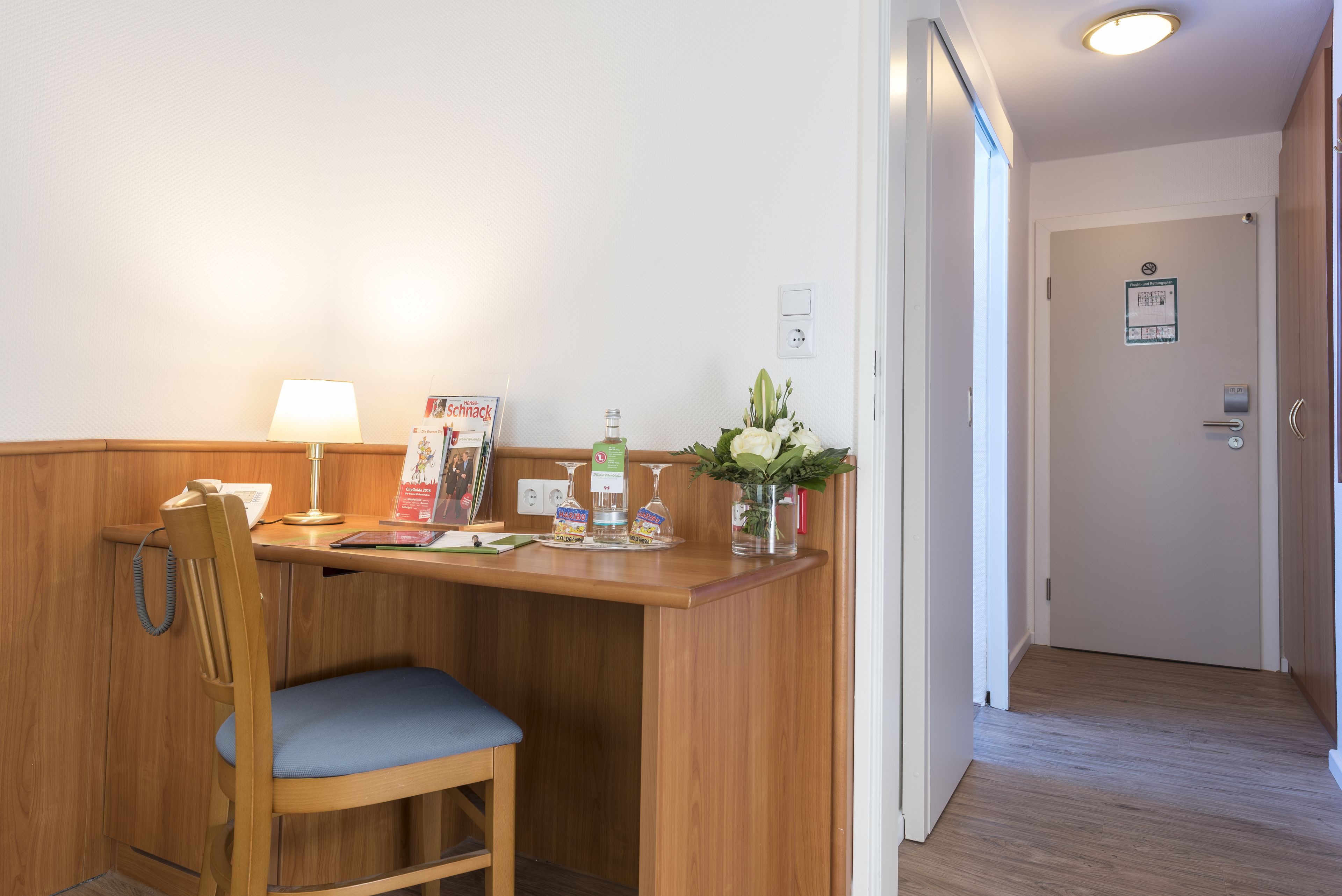 hypo-allergenic bedding, desk, laptop workspace, blackout curtains