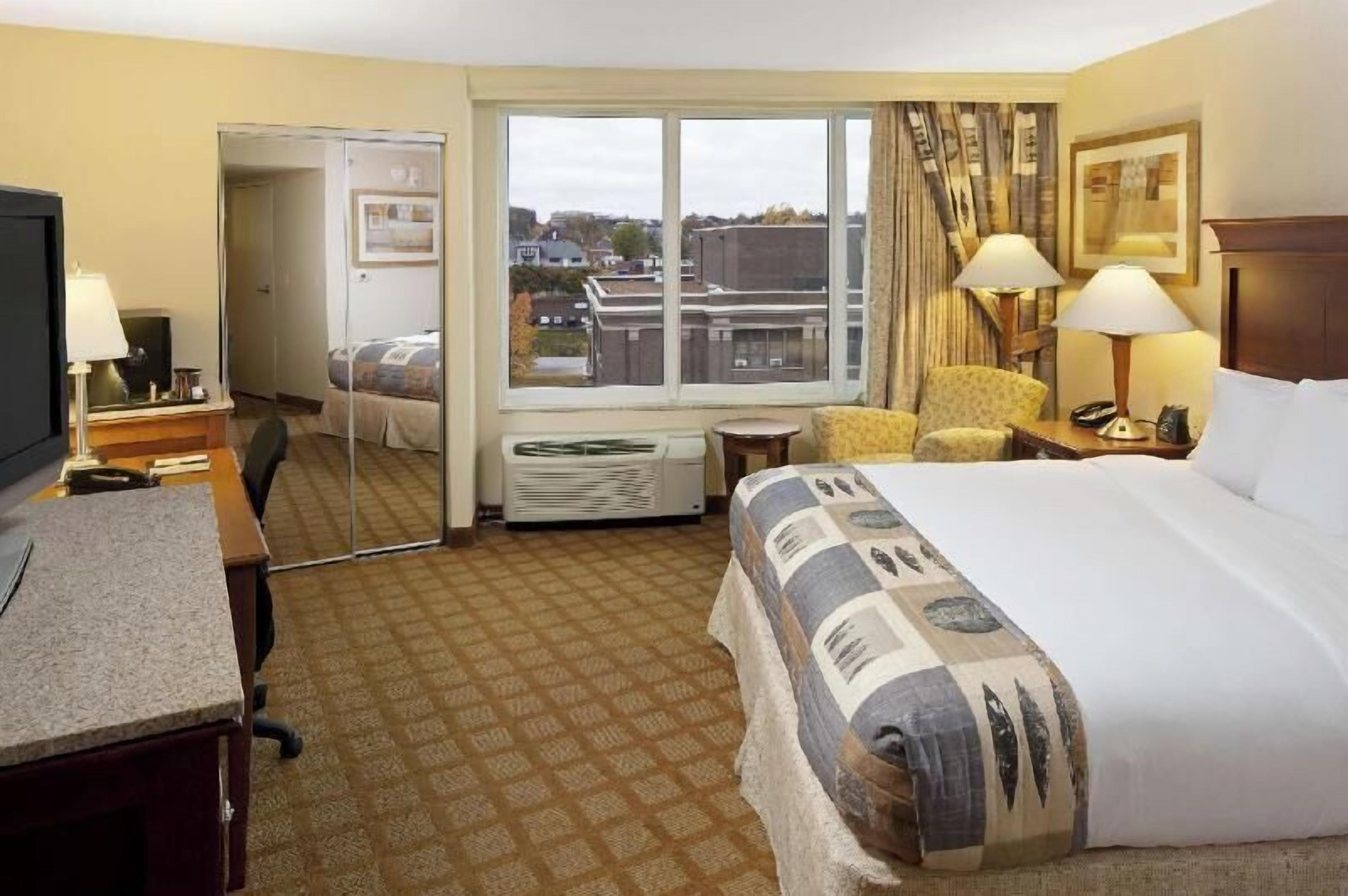 Premium bedding, down comforters, in-room safe, desk