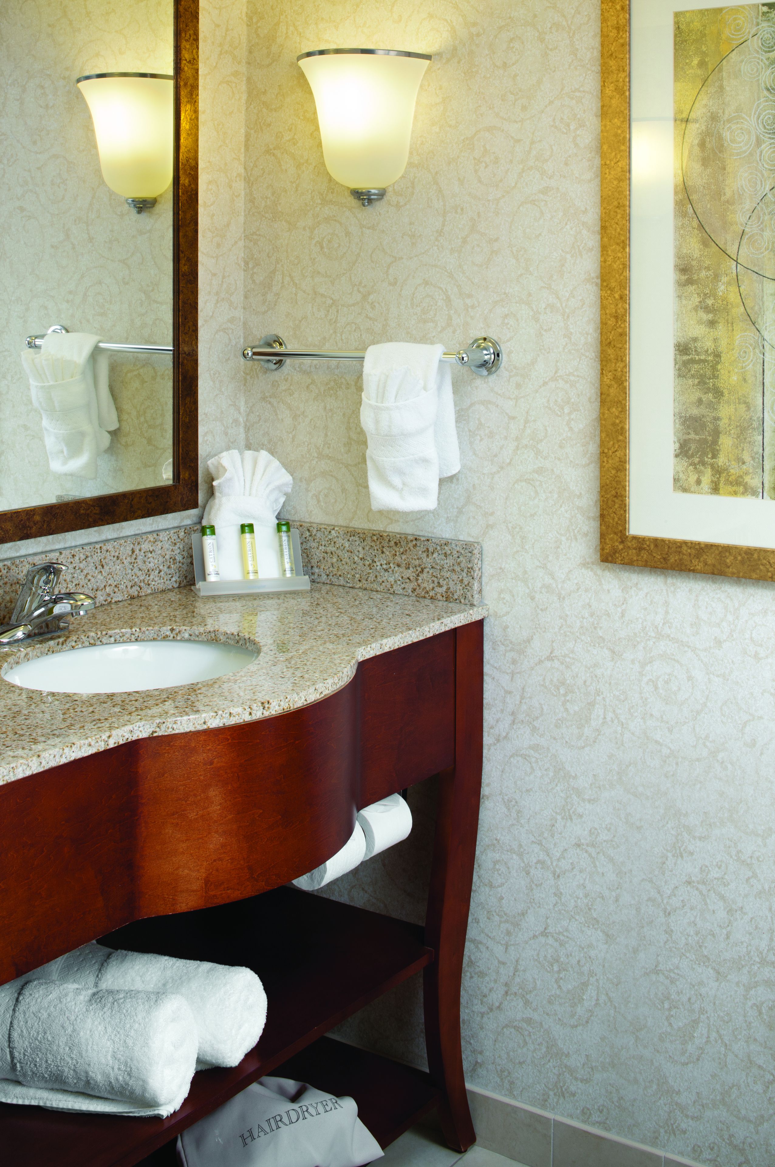 combined shower/bathtub, designer toiletries, hair dryer, towels