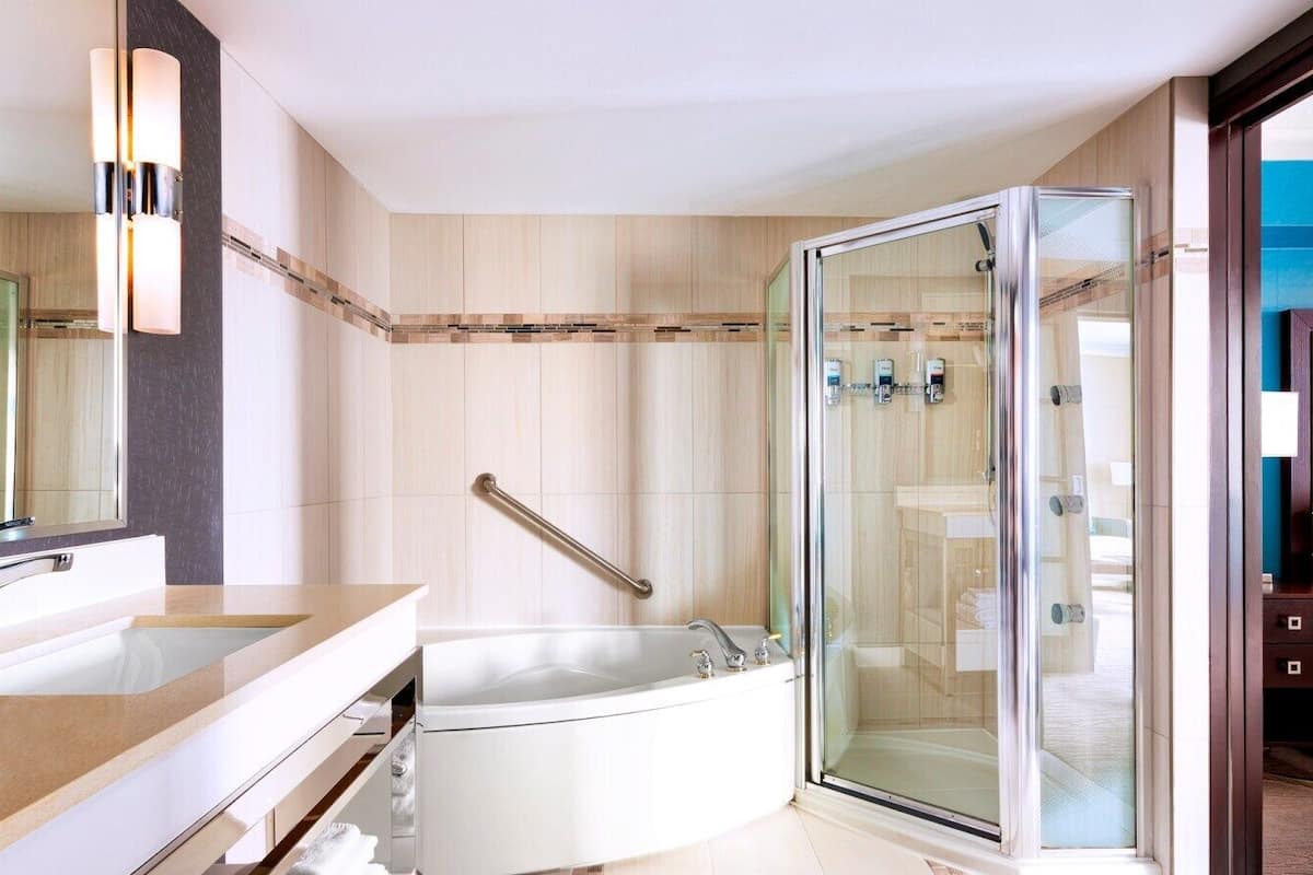 suite, 1 king bed with sofa bed, tower | 1 bedroom, premium bedding, in-room safe, desk