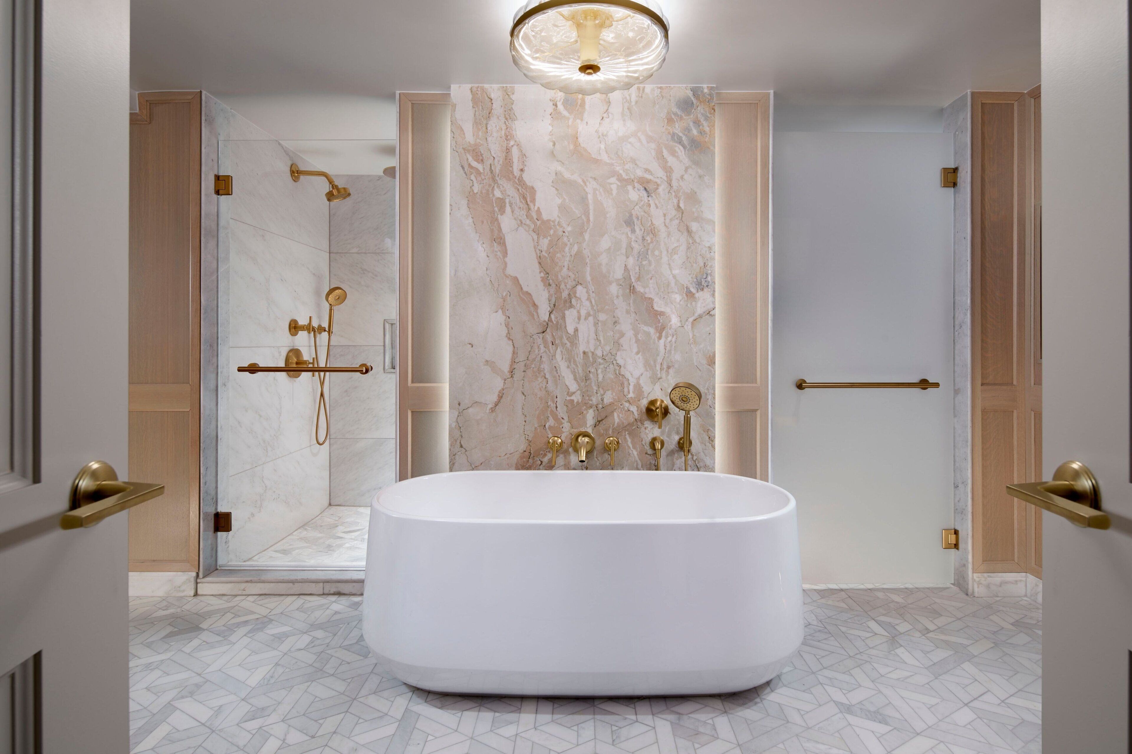 combined shower/bathtub, designer toiletries, hair dryer, bathrobes