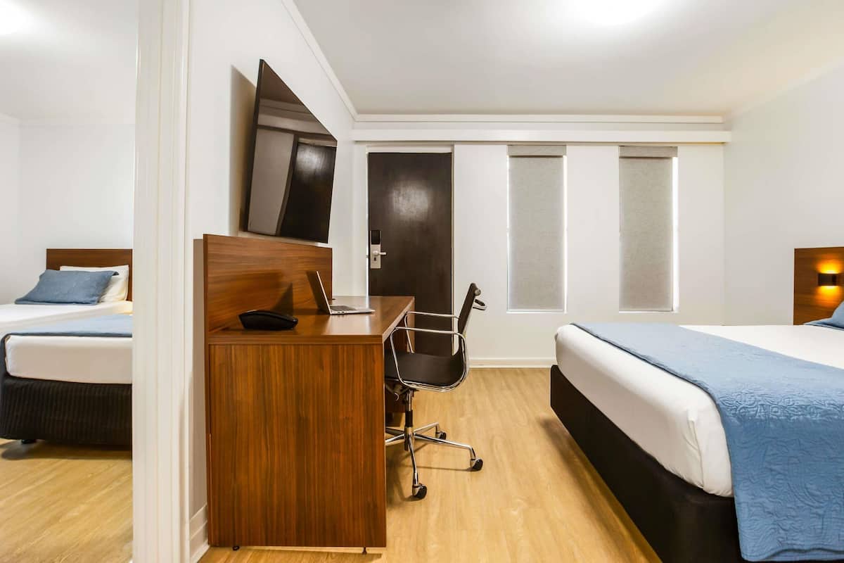 Family Room, Multiple Beds | Minibar, desk, soundproofing, iron/ironing board