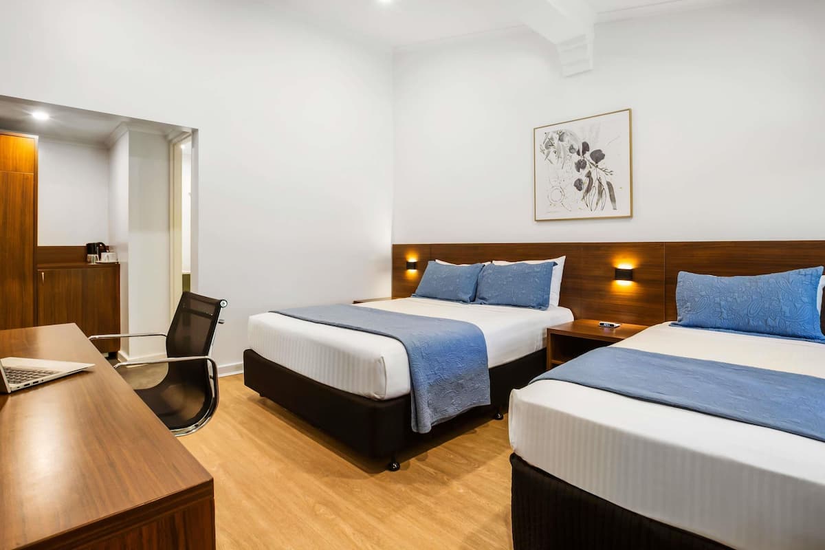 Standard Room, Multiple Beds | Minibar, desk, soundproofing, iron/ironing board