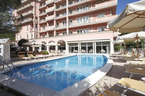 Seasonal outdoor pool, open 9:00 AM to 8:00 PM, pool umbrellas