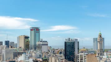 A cityscape with various buildings, including a clock tower and modern skyscrapers.