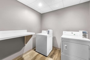 Laundry room with a washer and dryer, plus storage for your essentials.