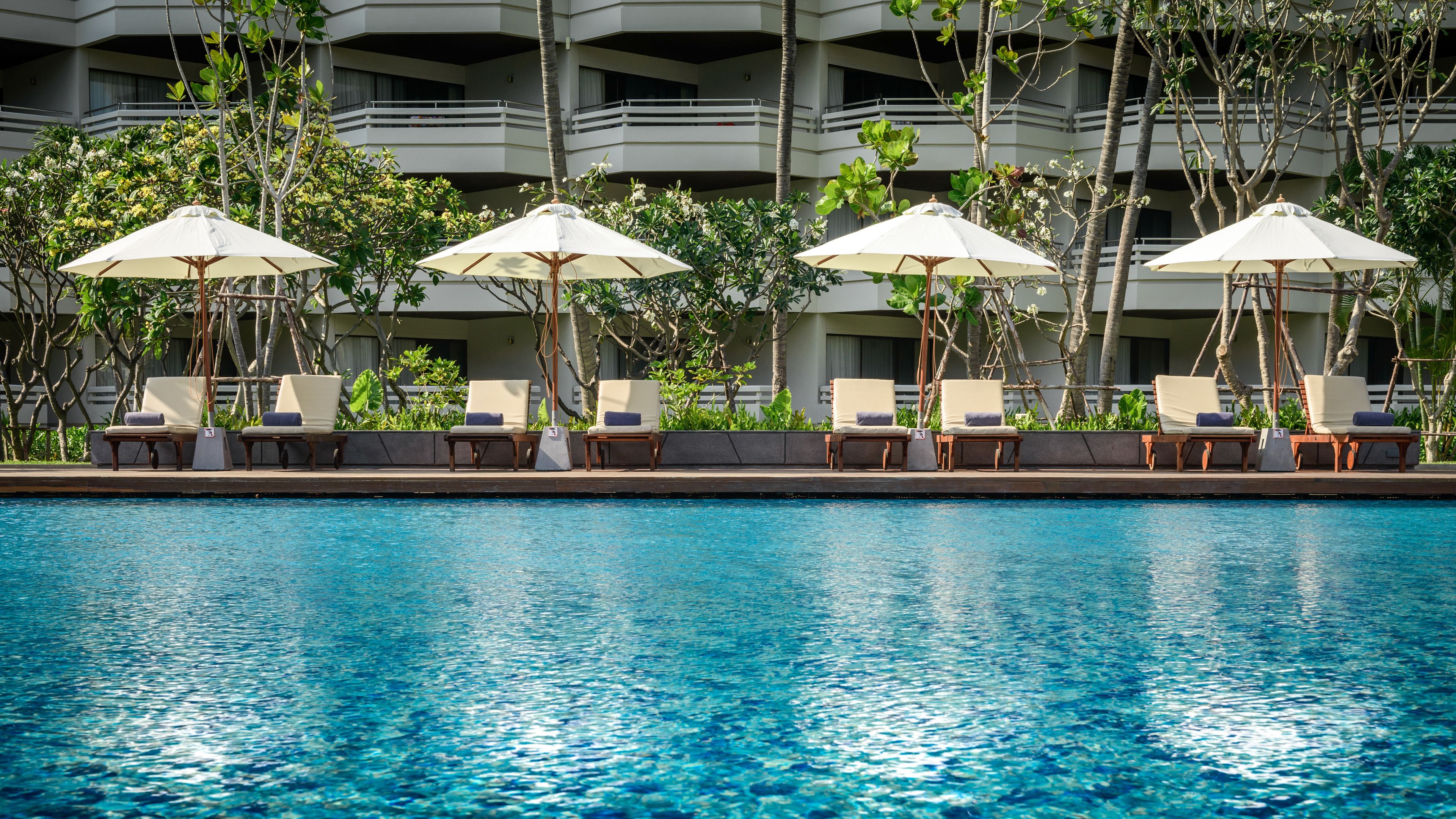 2 outdoor pools, open 7:00 AM to 8:00 PM, pool umbrellas, pool loungers