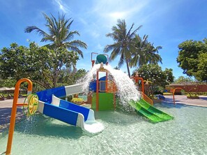 A water play area with slides and water jets, surrounded by palm trees and clear skies. - The Regent Cha-Am Beach Resort (Cha-am)