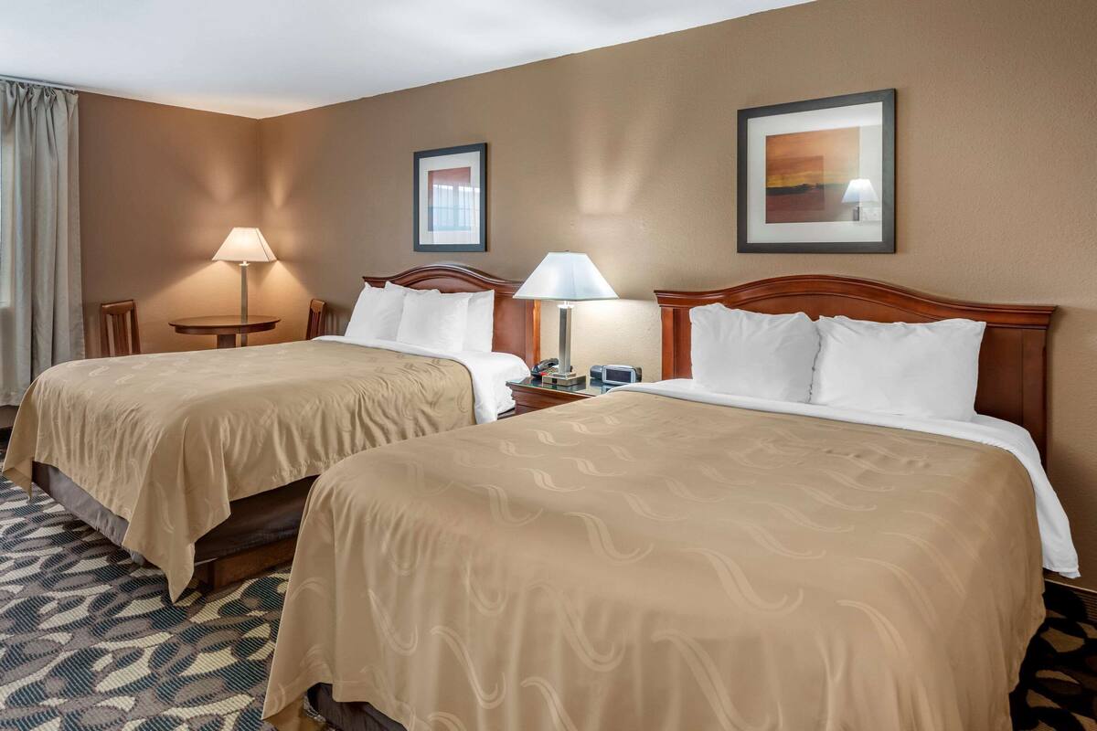 standard room, 2 queen beds, non smoking | in-room safe, iron/ironing board, free cots/infant beds