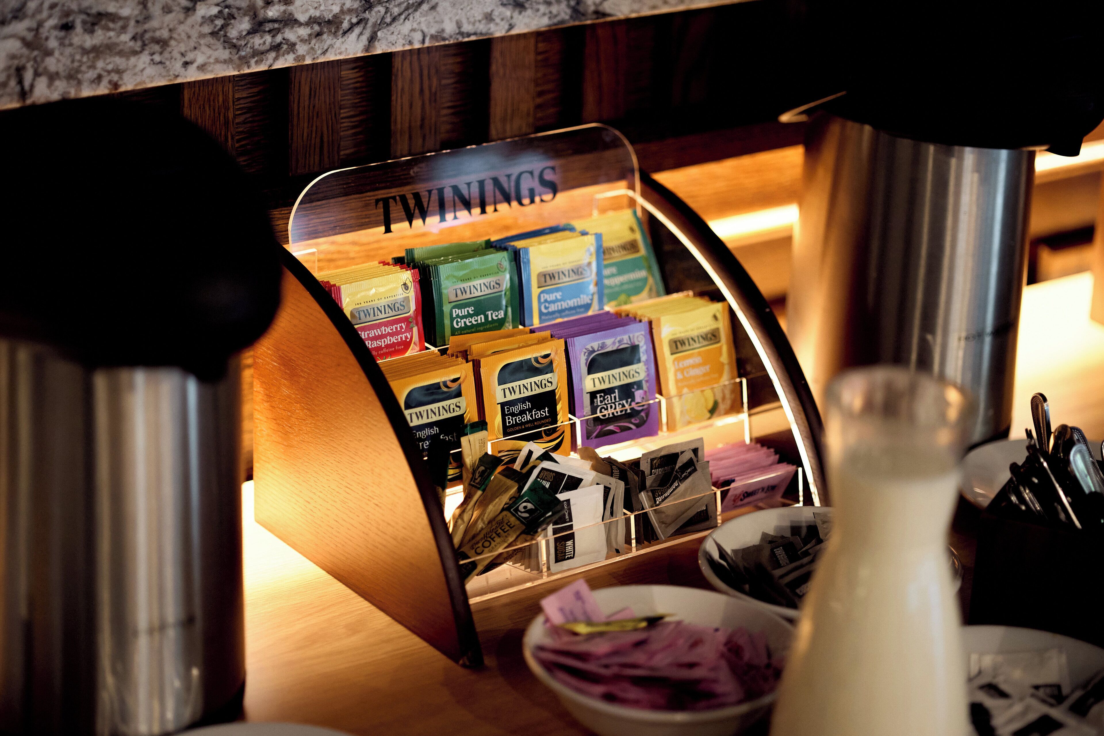 A display of Twinings tea boxes in a store.