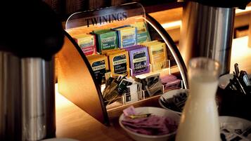 A display of Twinings tea boxes in a store.