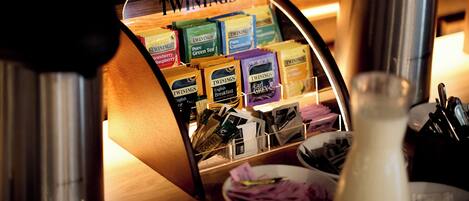 A display of Twinings tea boxes in a store.