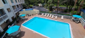 Outdoor pool, open 7:00 AM to 10:00 PM, pool umbrellas, sun loungers