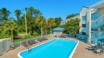 Outdoor pool, open 7:00 AM to 10:00 PM, pool umbrellas, sun loungers