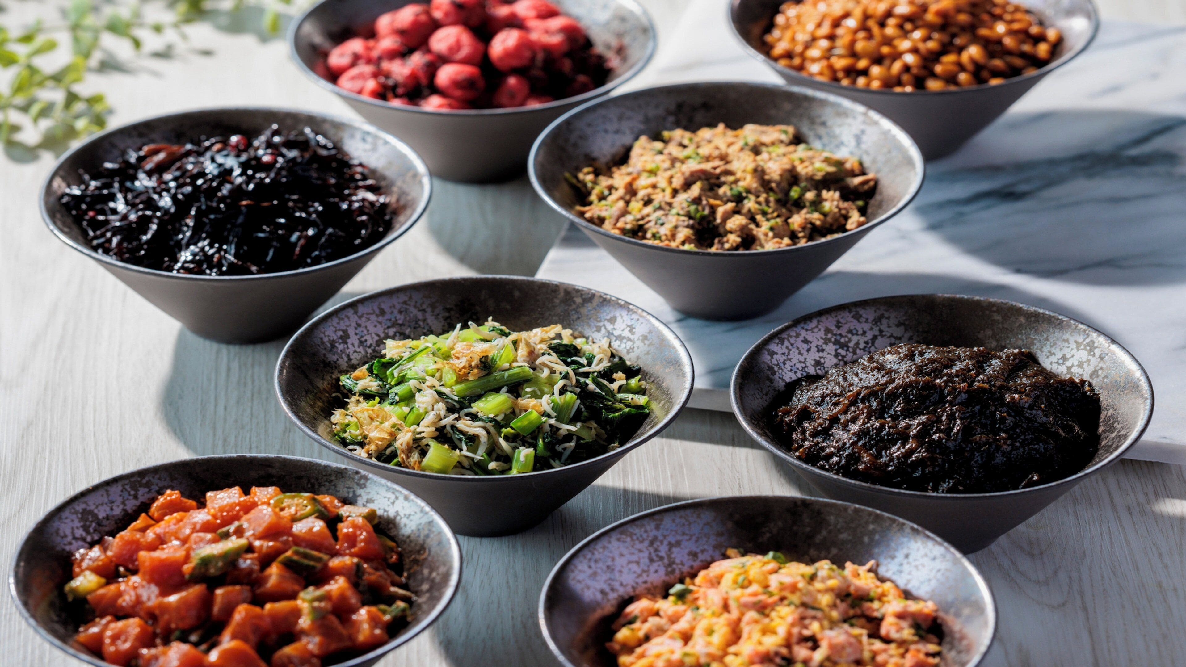 A variety of dishes in bowls on a table.