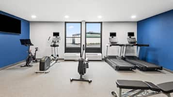 A fitness center with treadmills, an elliptical, and a stationary bike.