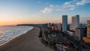 A coastal cityscape with a beach, high-rise buildings, and a clear sky. - Gooderson Tropicana Hotel (Durban)
