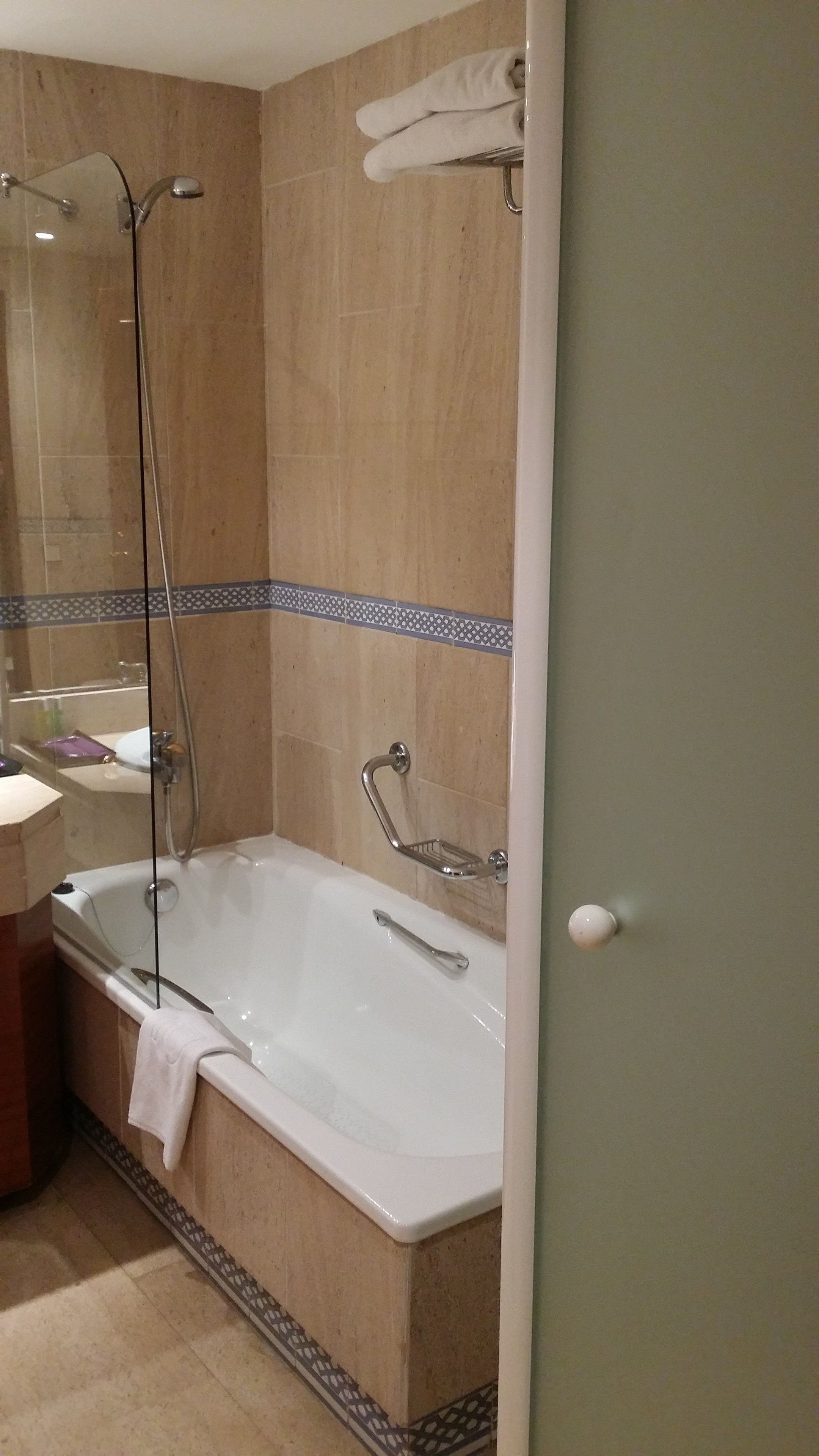 A bathroom with a bathtub, a shower, and a toilet.