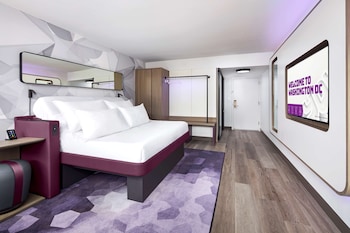 Hotel amenities such as safe, desk and work area at YOTEL Washington DC