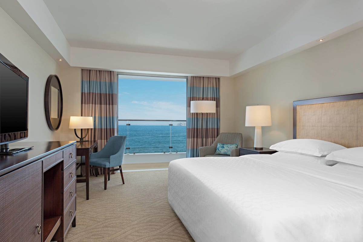 Deluxe Room, 1 King Bed, Oceanfront (Balcony) | Minibar, in-room safe, desk, iron/ironing board