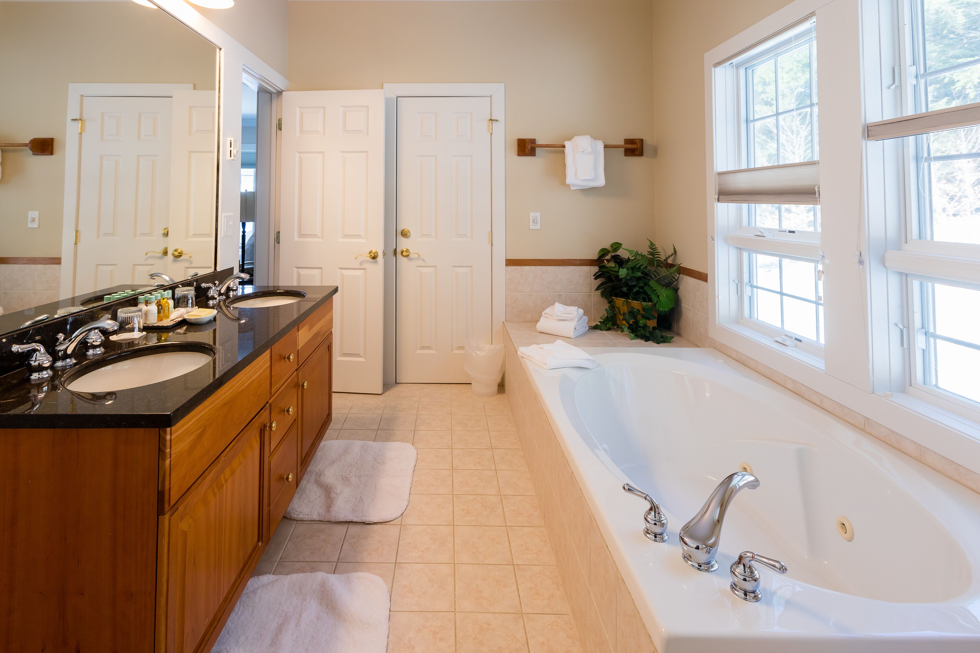 three bedroom resort home 654b | bathroom | combined shower/bathtub, designer toiletries, hair dryer, bathrobes