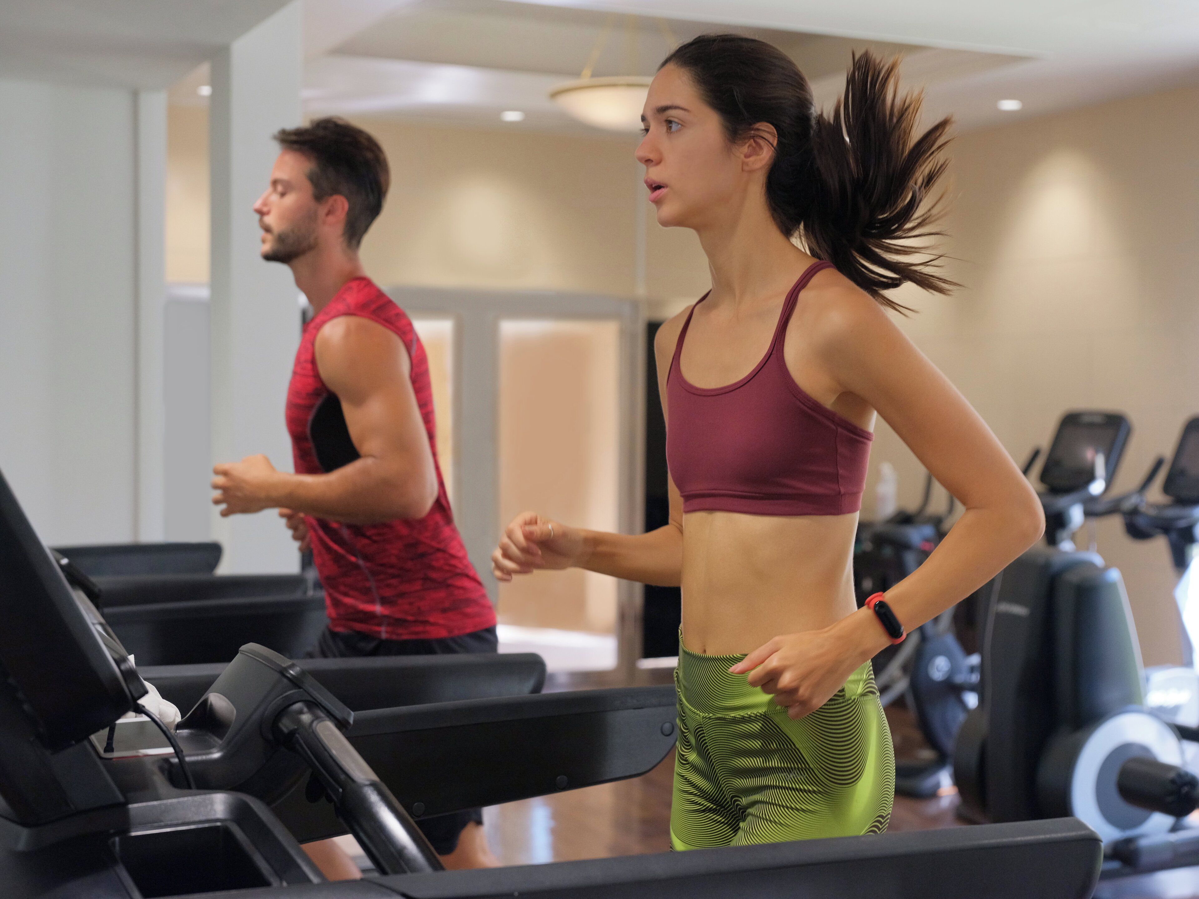 A gym with treadmills and exercise equipment.