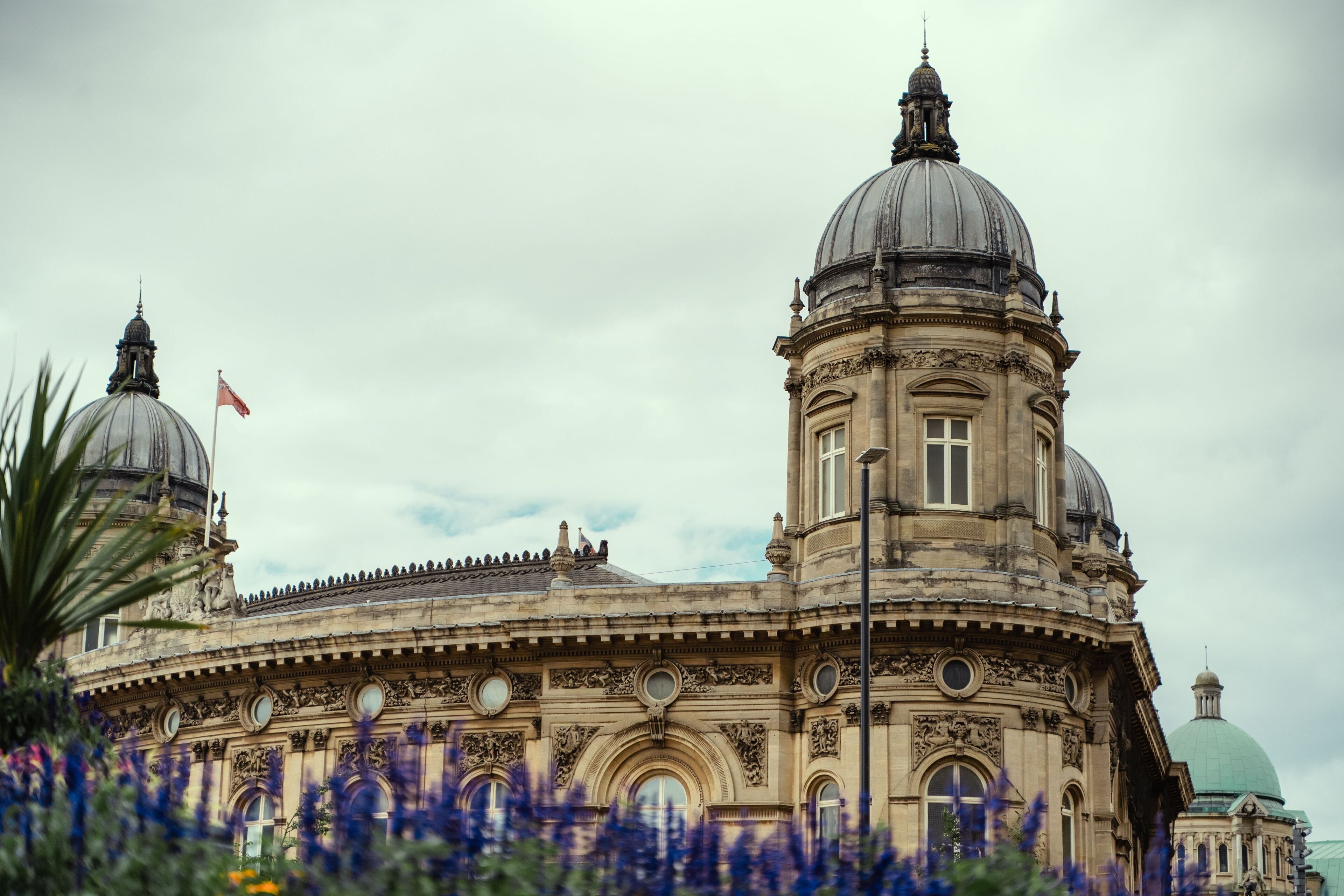 A historic building with two prominent domes and ornate architectural details.