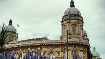 A historic building with two prominent domes and ornate architectural details.