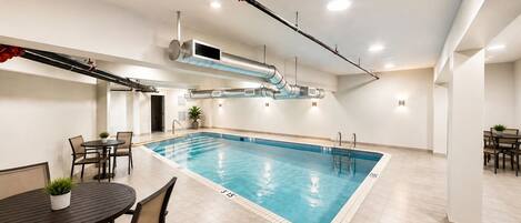 Indoor pool, open 9:00 AM to 9:00 PM, pool loungers