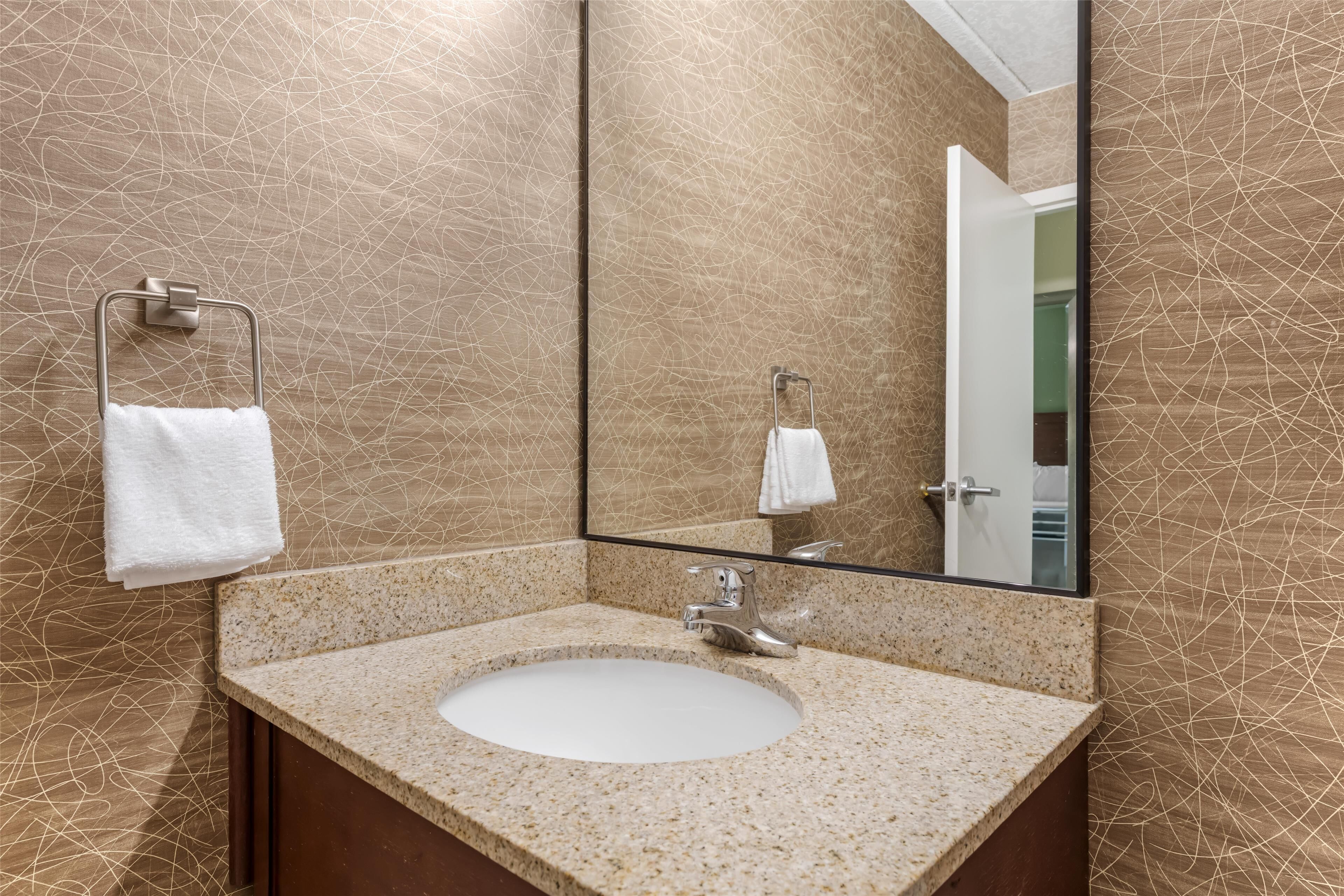 standard room, 2 queen beds, patio, poolside | bathroom | combined shower/bathtub, hair dryer, towels