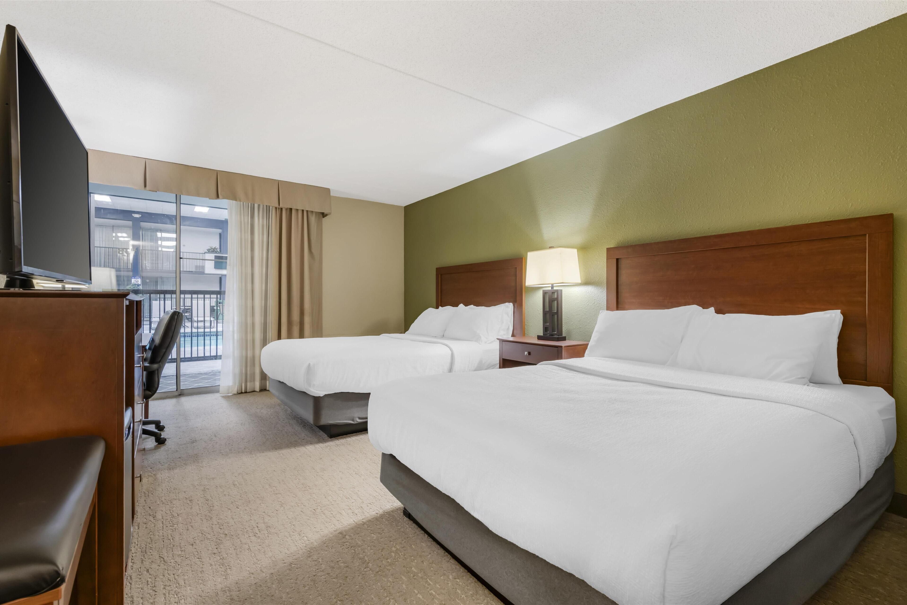 standard room, 2 queen beds, patio, poolside | individually furnished, desk, blackout curtains, iron/ironing board