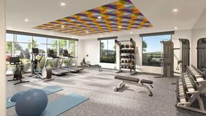A modern gym with cardio machines, free weights, and a piano. - Home2 Suites by Hilton Chelmsford Lowell (Chelmsford)