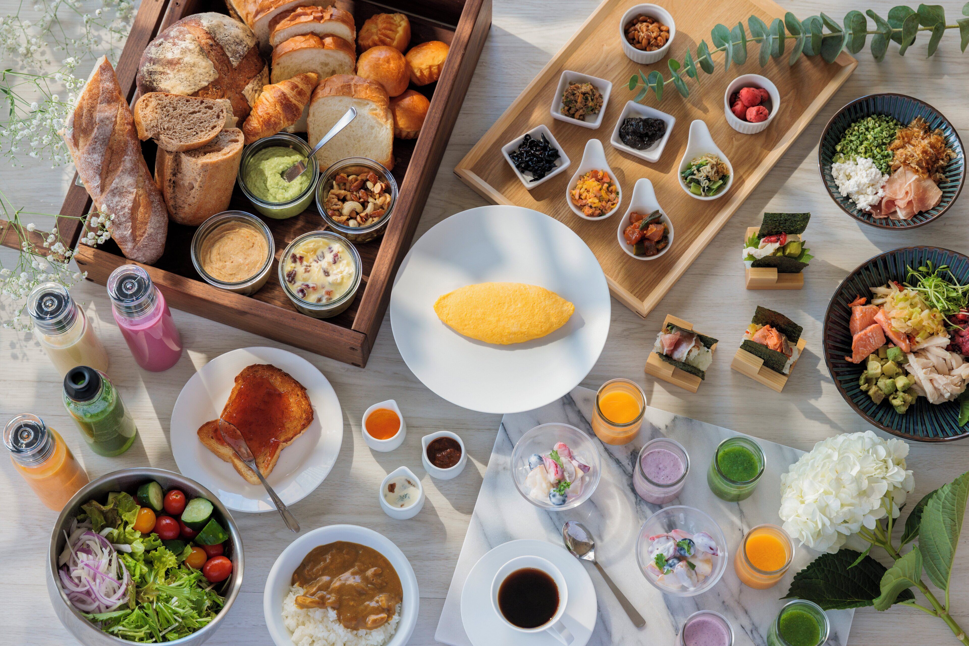 A variety of food items and beverages arranged on a table.